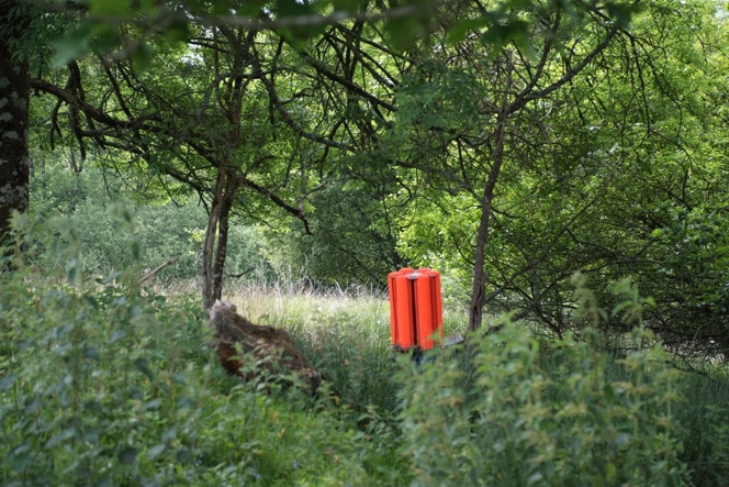 Bright coloured clay shooting traps stand out amongst the countryside.